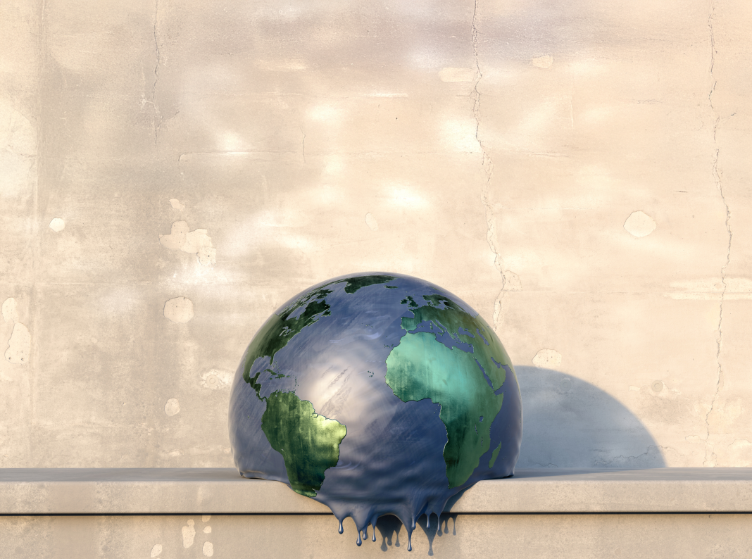 A spherical model of planet earth sitting on a concrete shelf on a hot day, deflating and melting. The globe has a blue 'sea' and metallic green 'land' and has drips forming at it's base as it heats up. COP30 will celebrate the tenth anniversary of the Paris Agreement but where, Richard Beardsworth asks, do things stand ten years on?