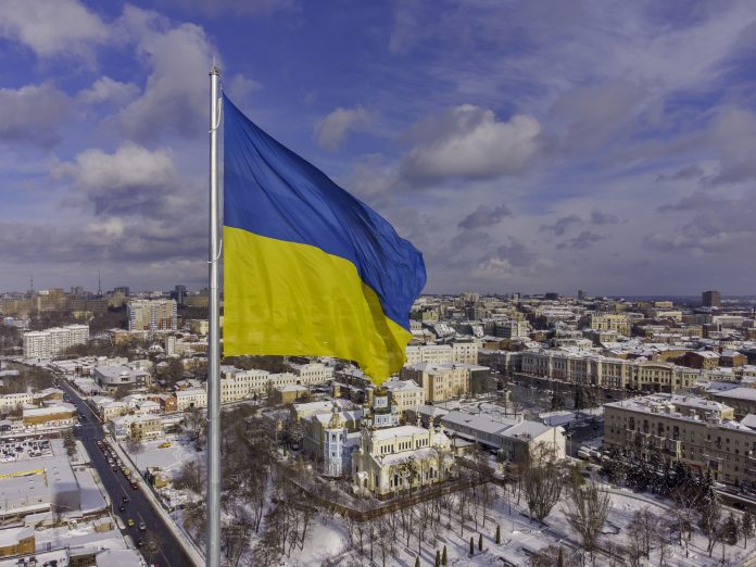 Ukrainian flag in the wind. Blue Yellow flag in the city of Kharkov