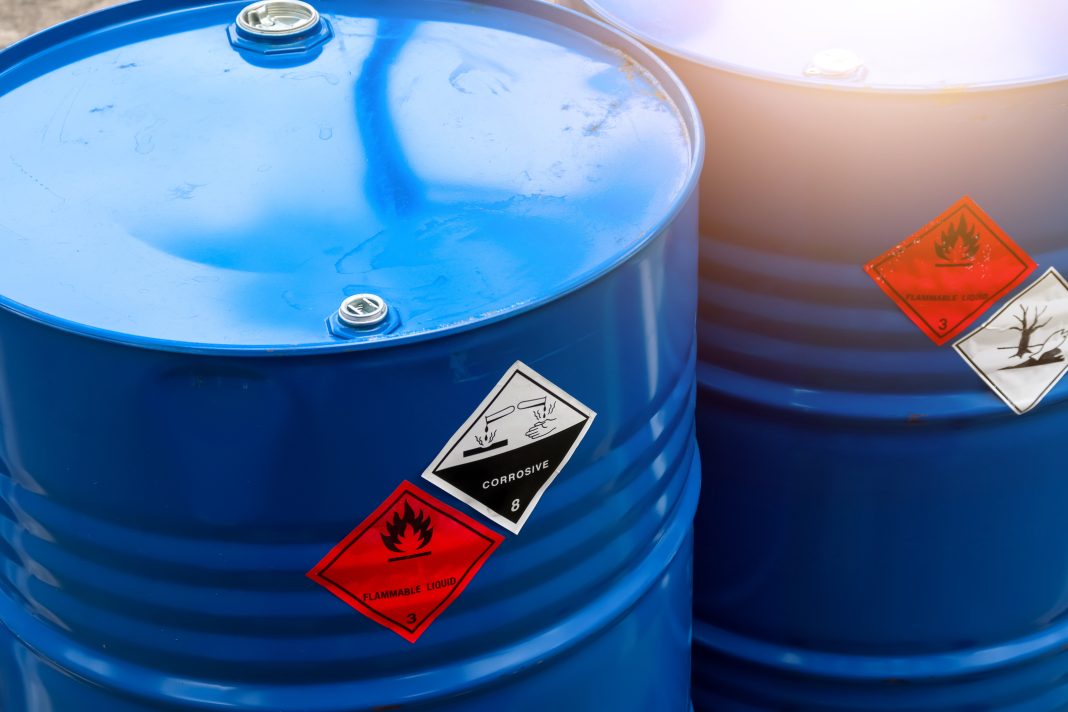 Warning symbol for chemical hazard on chemical container, chemical in factory