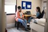 Patient talking with her doctor during an appointment in her office