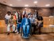 Portrait of a wheelchair businessman and coworkers during presentation at office