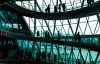 Abstract modern architecture and silhouettes of people on spiral staircase